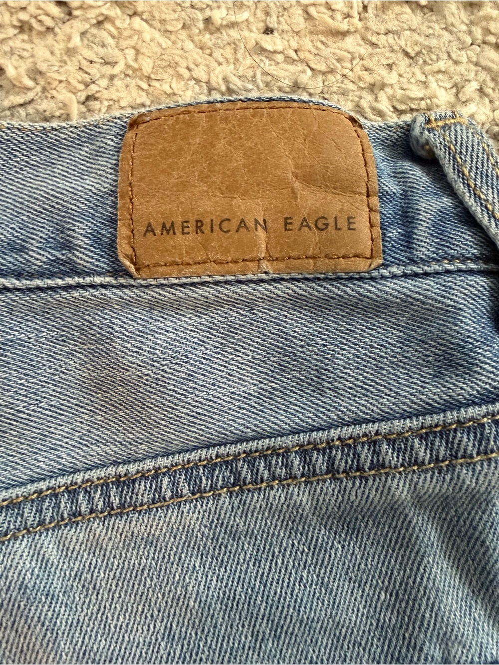 American Eagle Blue Denim Jeans with Tan Stitching